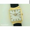 Omega 18ct gold automatic on strap