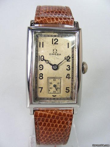 Omega Rectangulaire vintage annee 1930's galbee acier/cuir